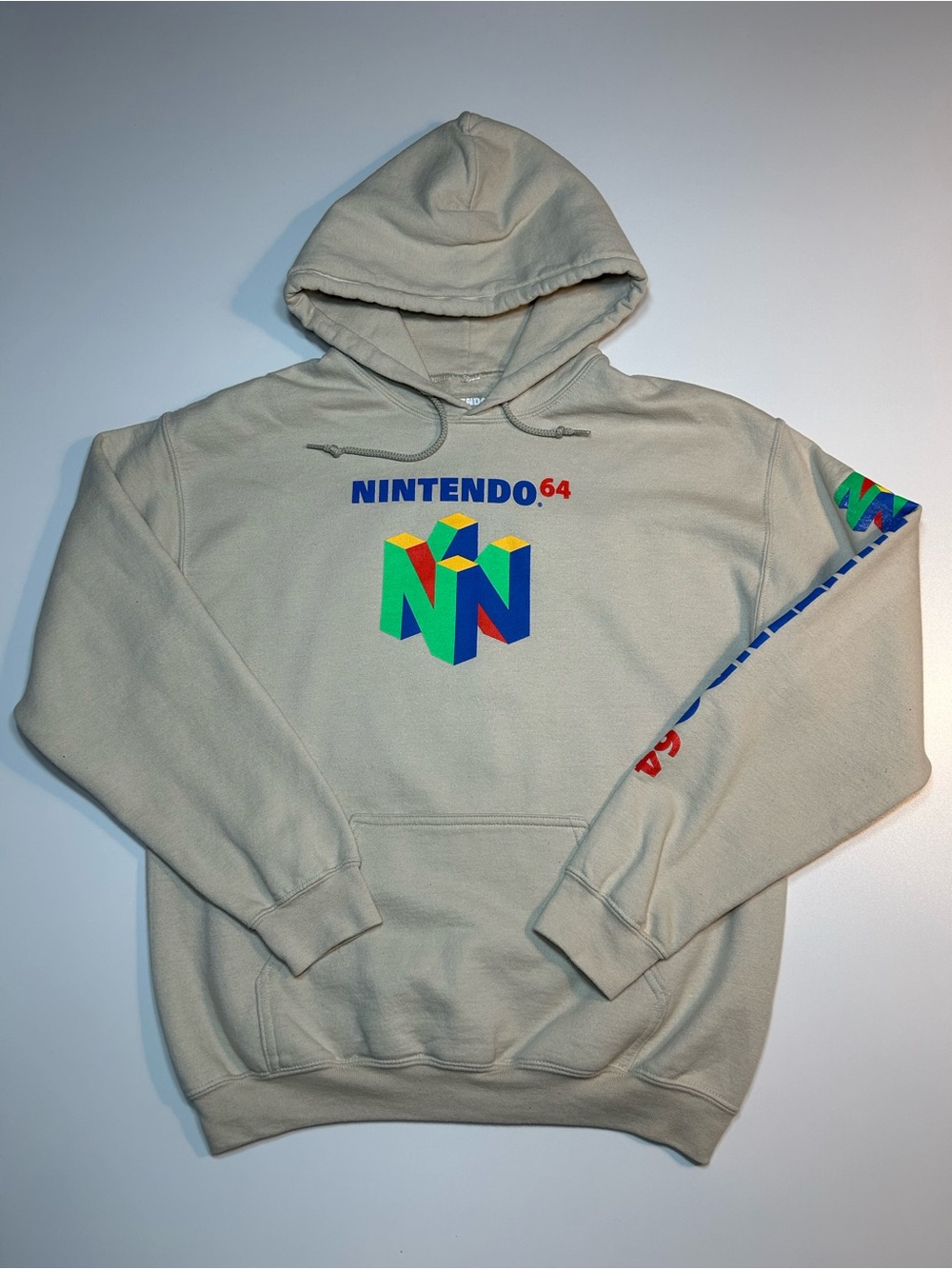Official Nintendo 64 Retro Logo Graphic Sleeve Print Hoodie Tan Cream